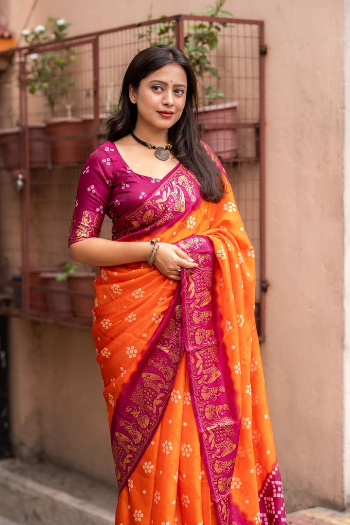 Sunrise Orange soft crape type self-woven smooth fabric with figure woven design border saree.