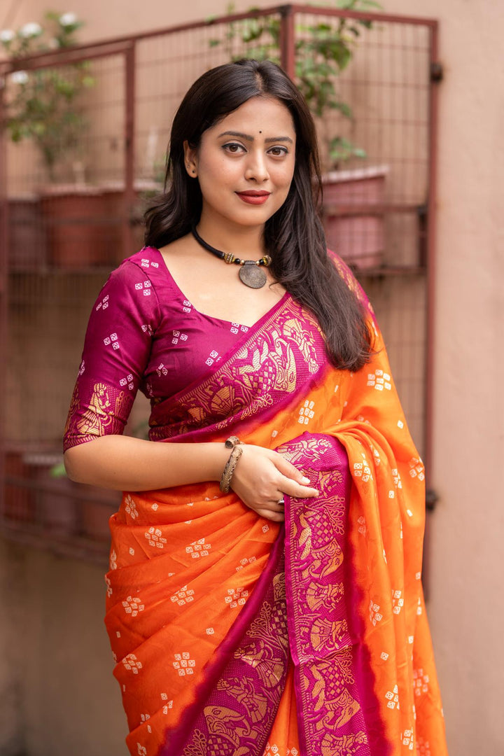 Sunrise Orange soft crape type self-woven smooth fabric with figure woven design border saree.