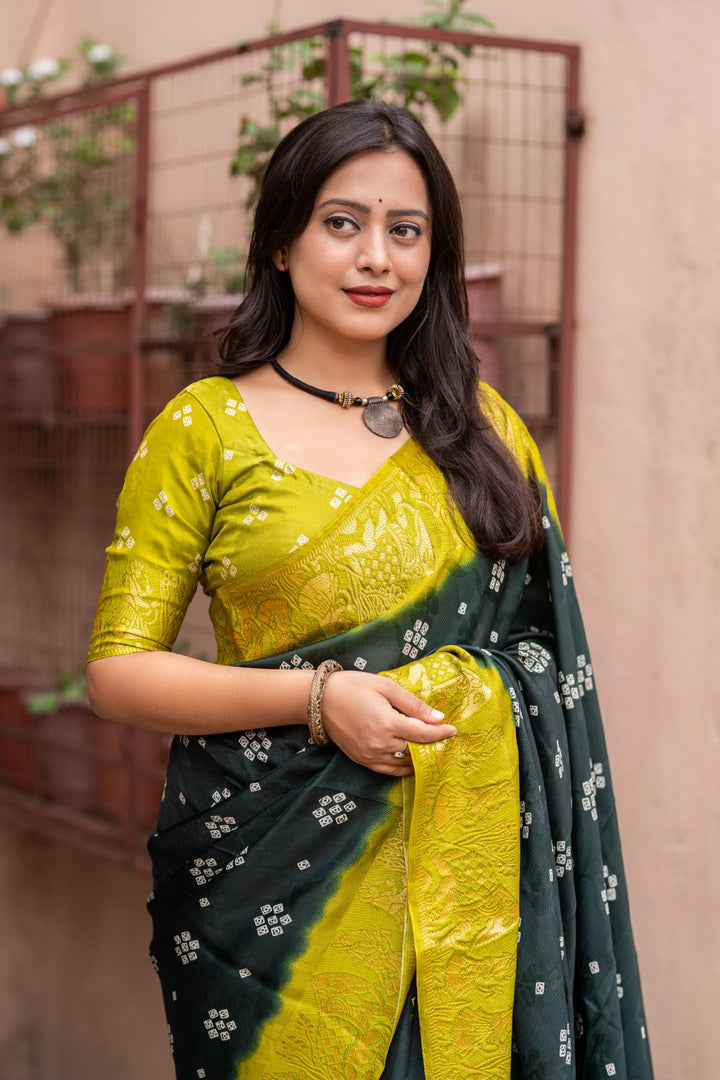 Dark Green soft crape type self-woven smooth fabric with figure woven design border saree.