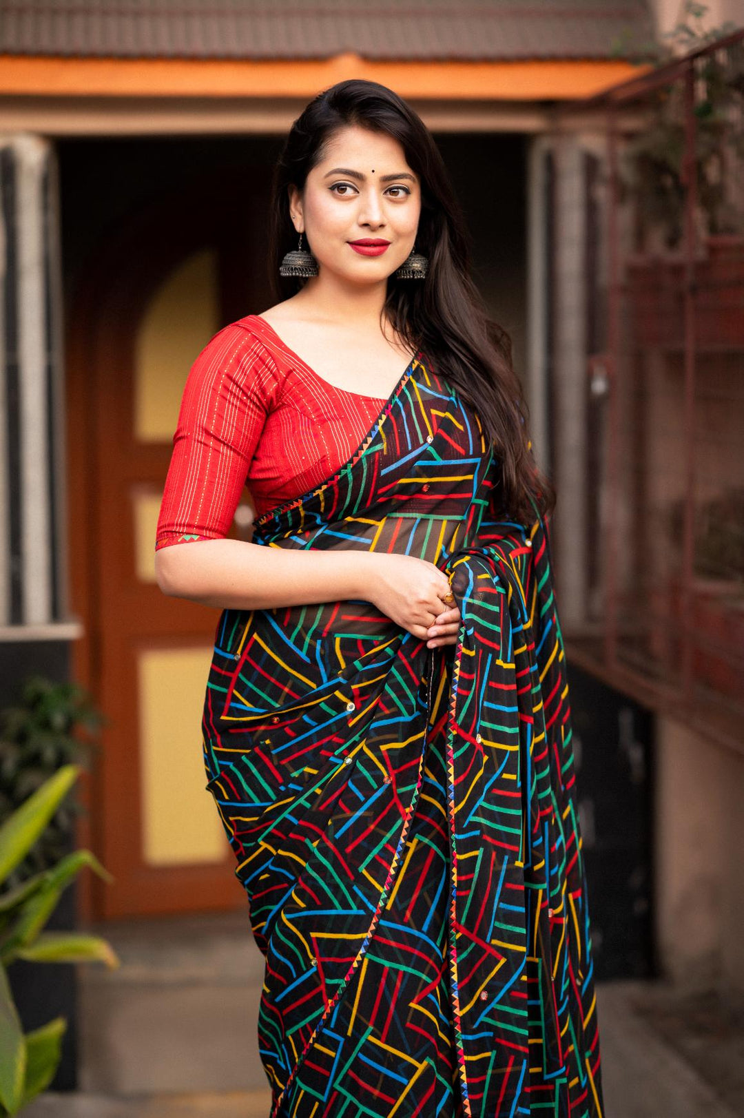 Black soft georgette with multicolor geometric prints saree.