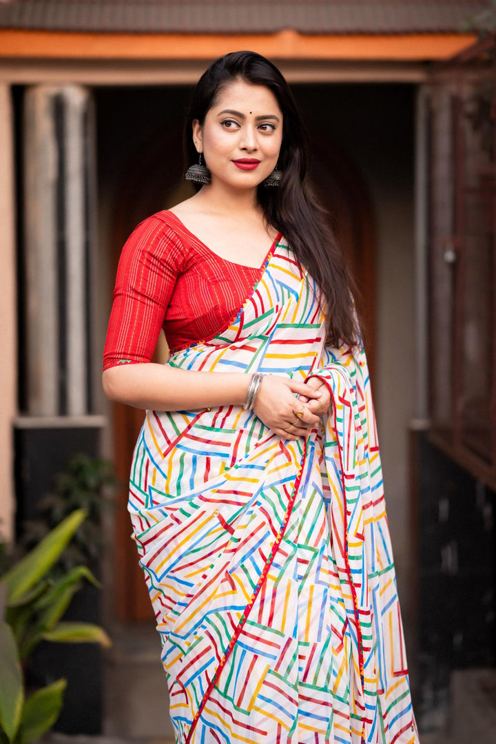 Spanish White soft georgette with multicolor geometric prints saree.