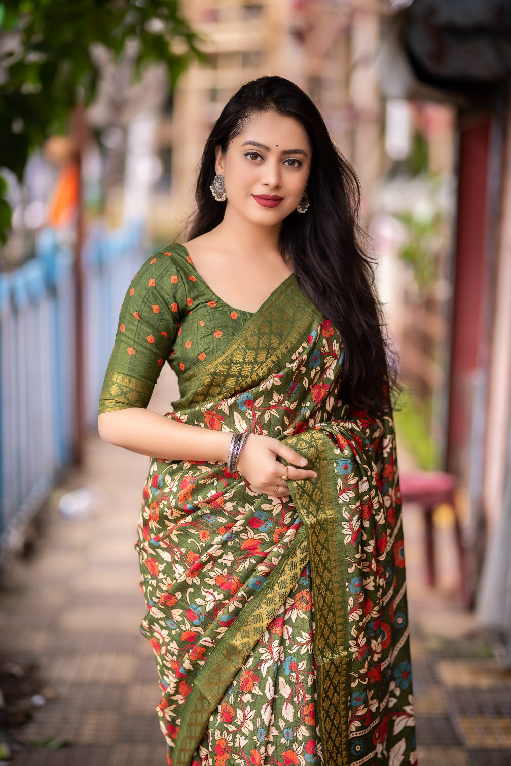 Olive Green soft slub silk kalamkari printed with Jacq woven Zari border saree.