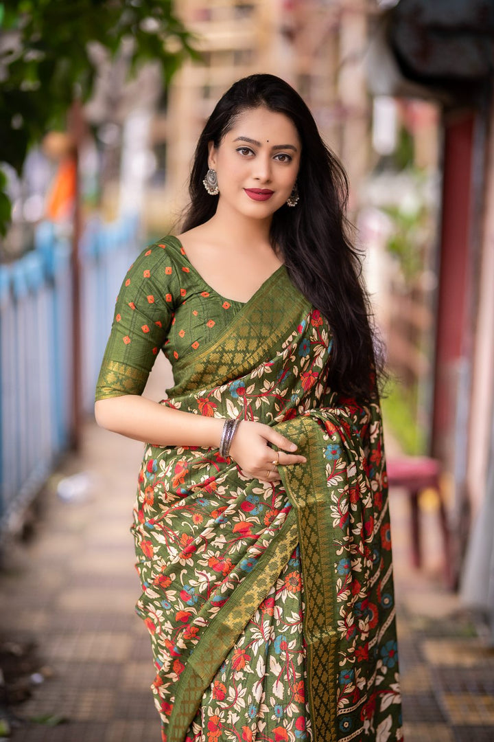 Olive Green soft slub silk kalamkari printed with Jacq woven Zari border saree.