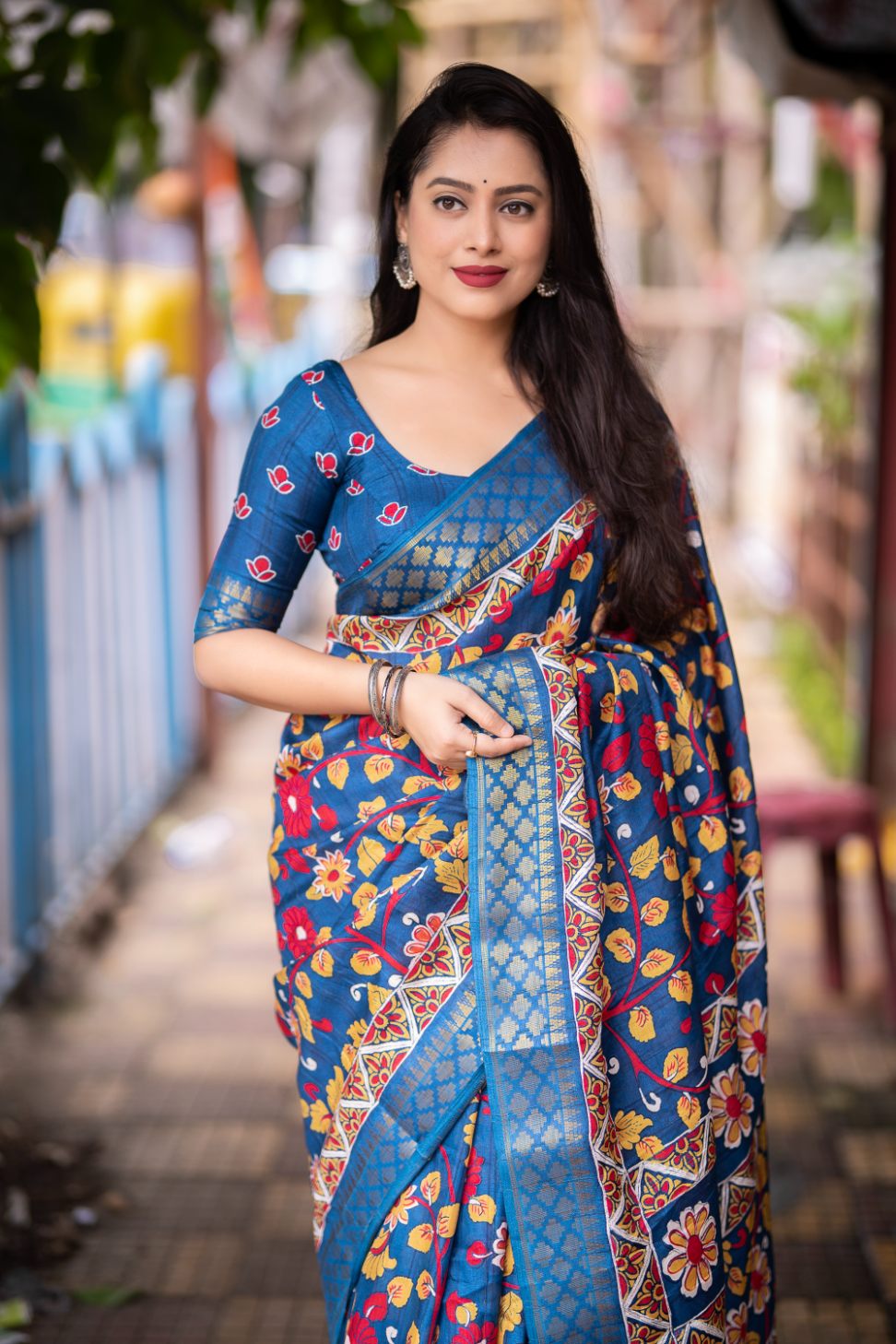 Mid Blue soft slub silk kalamkari printed with Jacq woven Zari border saree.