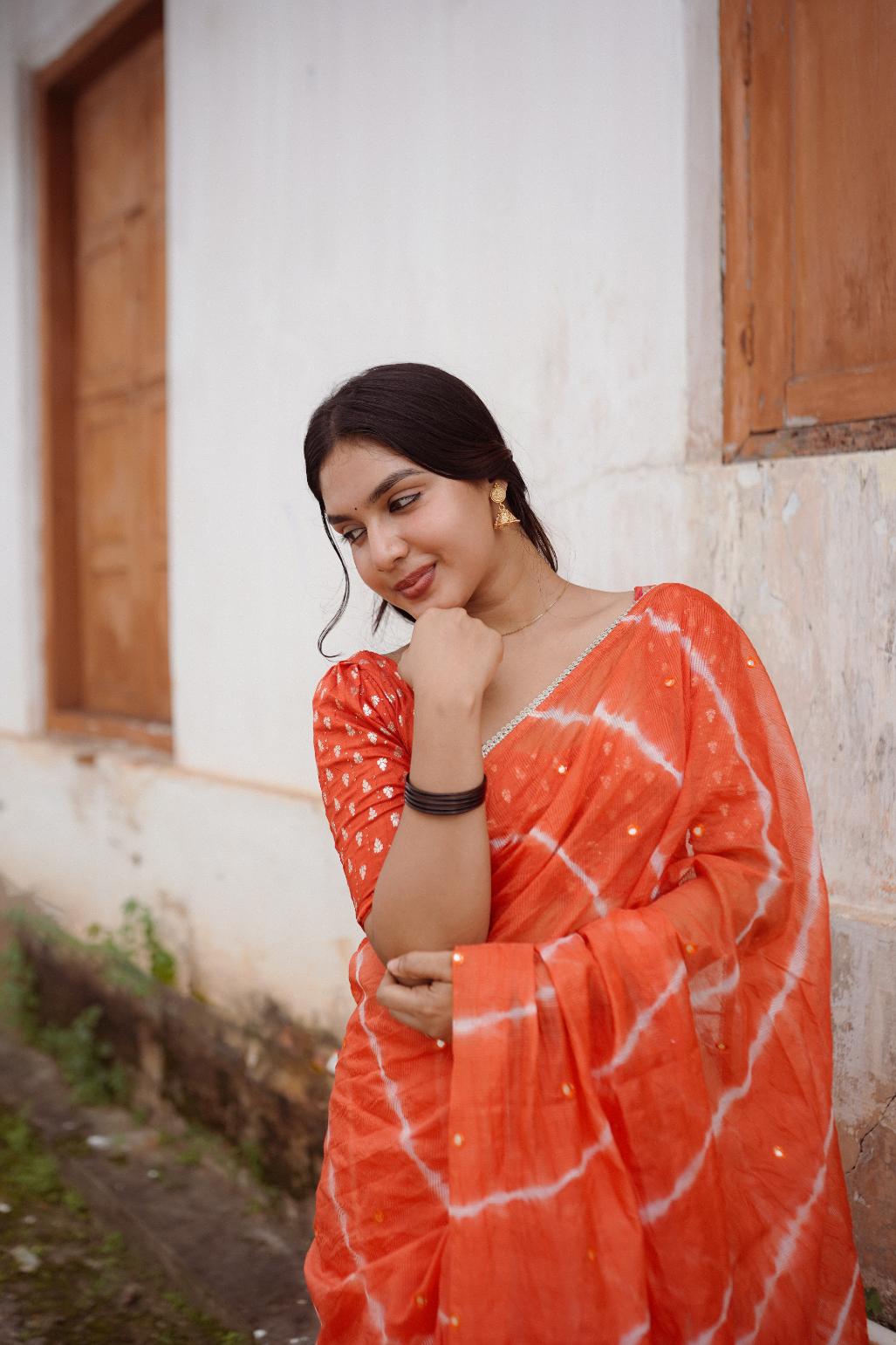 Tangy Orange pure Kota saree with tye and dye leheriya.