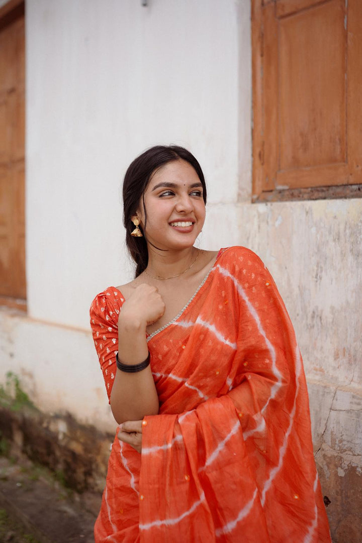 Tangy Orange pure Kota saree with tye and dye leheriya.