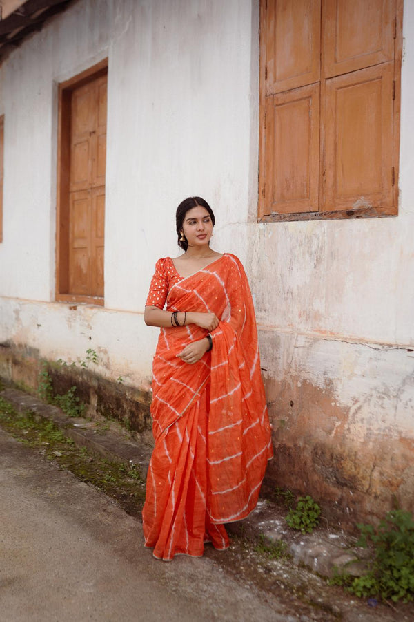 Tangy Orange pure Kota saree with tye and dye leheriya.